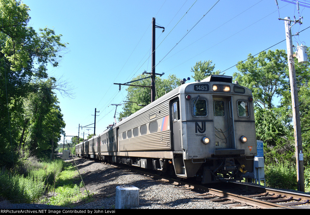 NJT Train # 430, being led by Arrow III Cab Car # 1483 is about to cross the pedestrian path that feeds into Lackawanna Avenue 